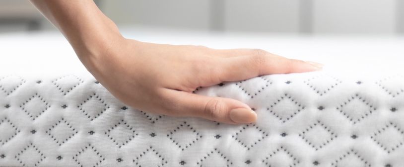 Hand on the Micro Quilted Cover of an Endy mattress